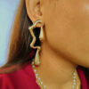 Abstract gold earrings with anti-tarnish finish for party wear