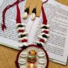 Handmade fabric jewellery design with cowrie shells and traditional pendant