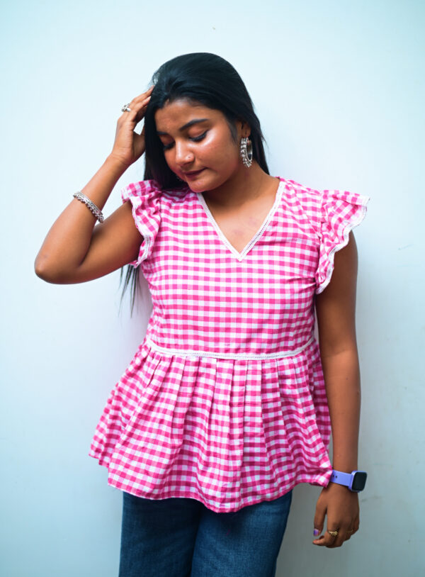 Elegant pink short kurti with a chic design, ideal for college and daily wear.