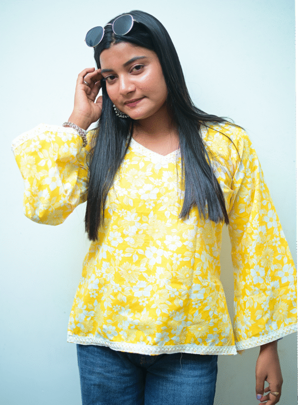 trendy yellow short kurti with lace and floral prints